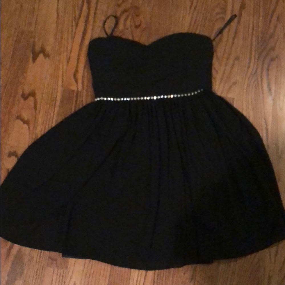 A strapless mini black dress with a diamond belt!